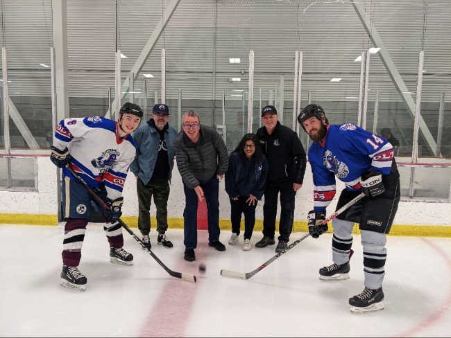 Face Off! Past President Marty Jones, Treasurer Tony Miles, Division Director Dee Purewal and Director of Hockey Craig Sherbaty . Taking the faceoff is Brad Ewing (team white) vs Braedon Nelson (team blue)